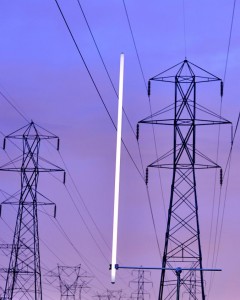 Flourescent tube glowing under electric power lines Flourescent tube glowing under electric power lines